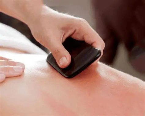 Gua sha manual therapy treatment for muscle relief
